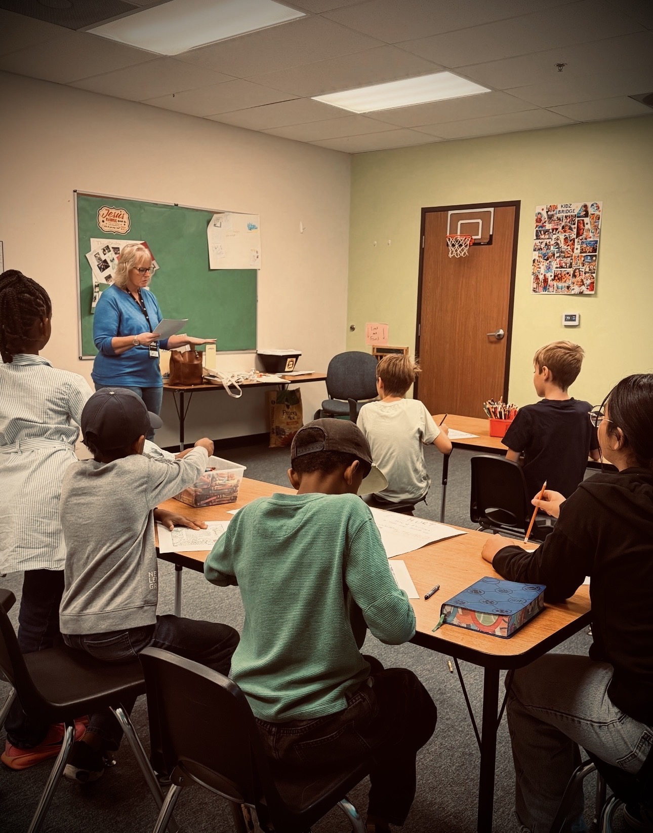 Children participating in a creative activity at Kidz Bridge.